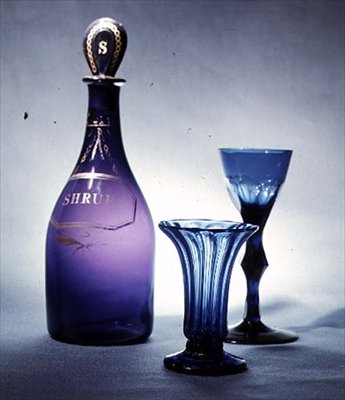 Blue glass custard bowl, c.1760; blue glass decanter and wine glass with facet cut stem, c.1780 by English School